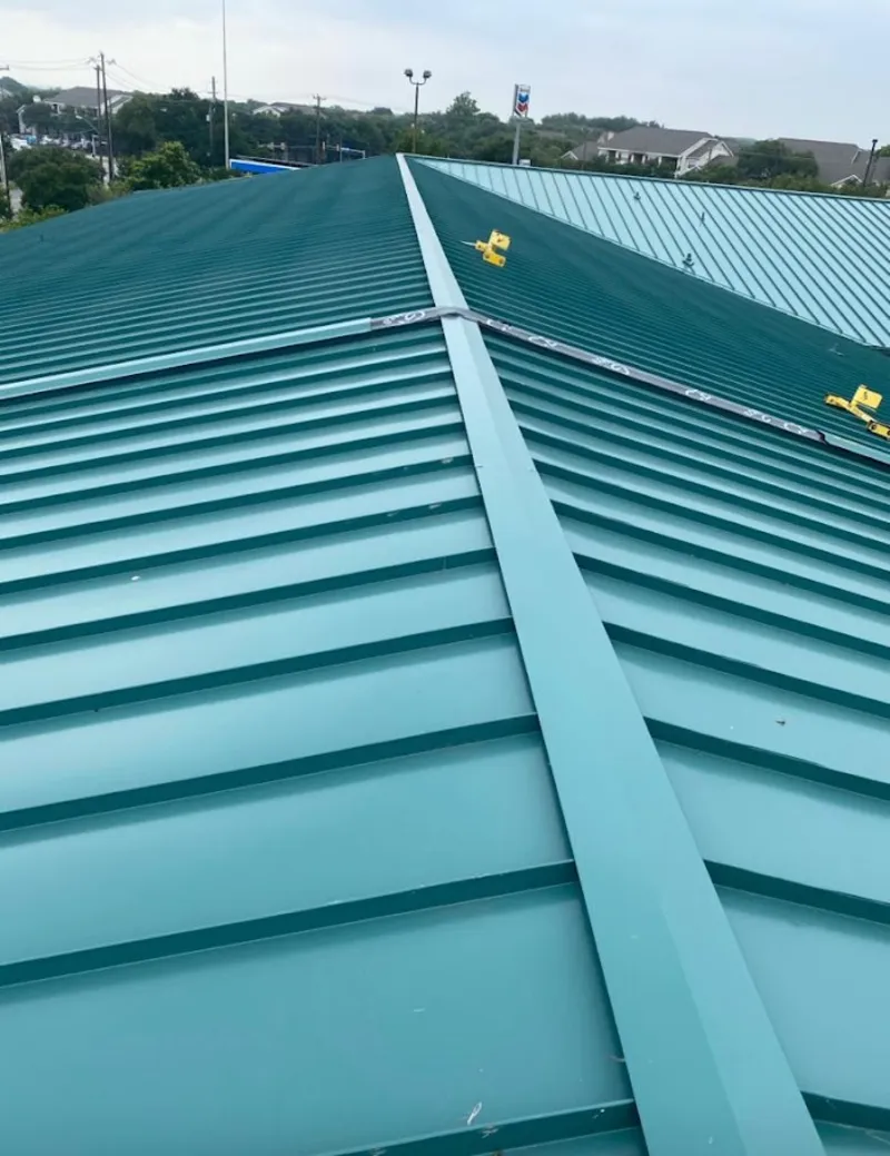 Green commercial metal roof ridge and valley for Metal Roof Repair in Otsego